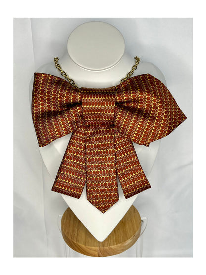 Bild framifrån av Slipsrosett i varm kopparton med ett finvävt mönster